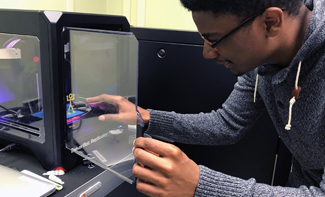 student using a 3D printer