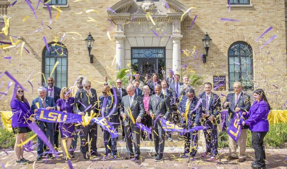 image of crowd cutting ribbon and confetti at LSU Huey P. Long Fieldhouse