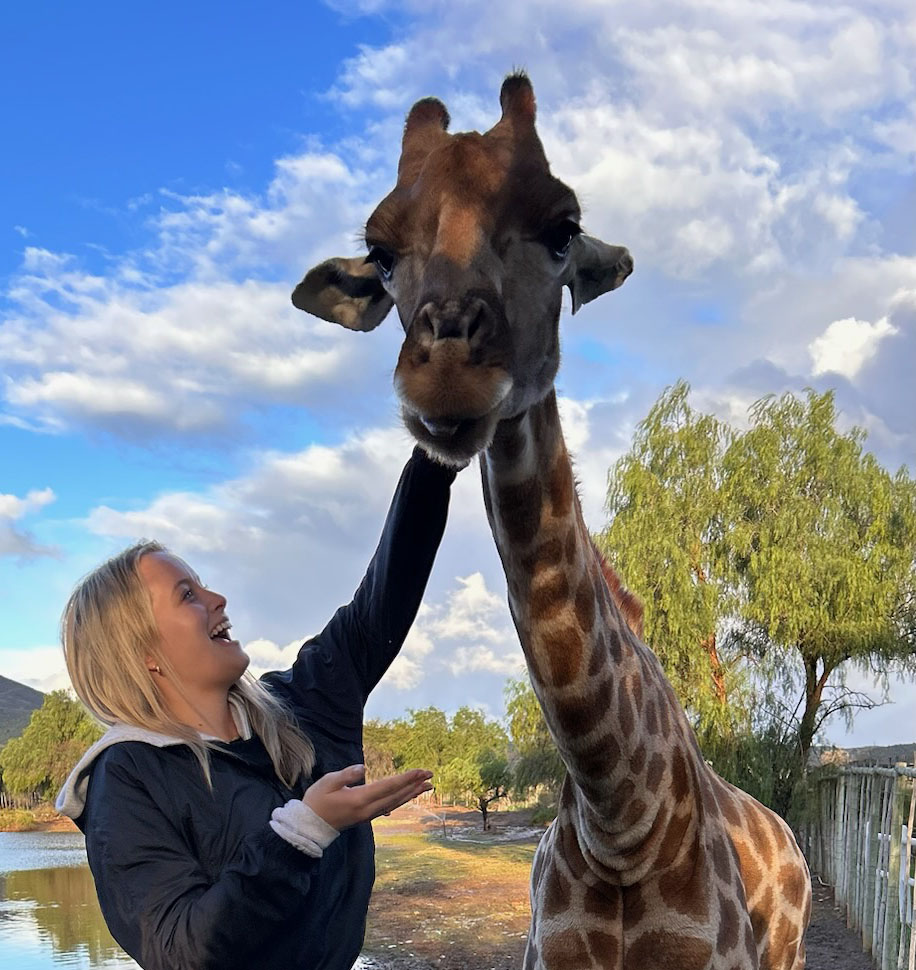 Georgia Howard with a giraffe