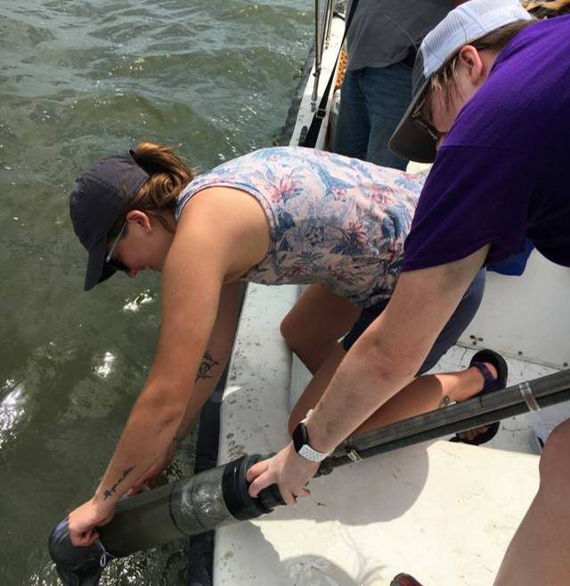 LSU researchers retrieve a core sample from the waters of the Gulf of Mexico.