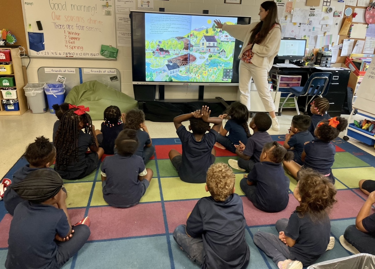 Caroline Hargrave teaches a group of children in a classroom