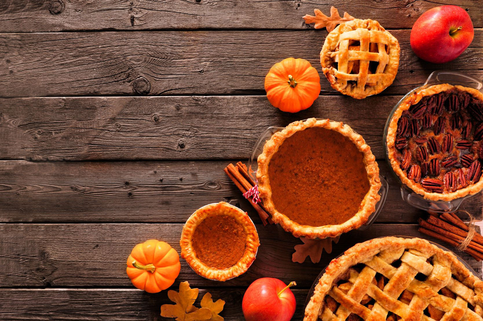 various Thanksgiving foods on a wooden tabletop