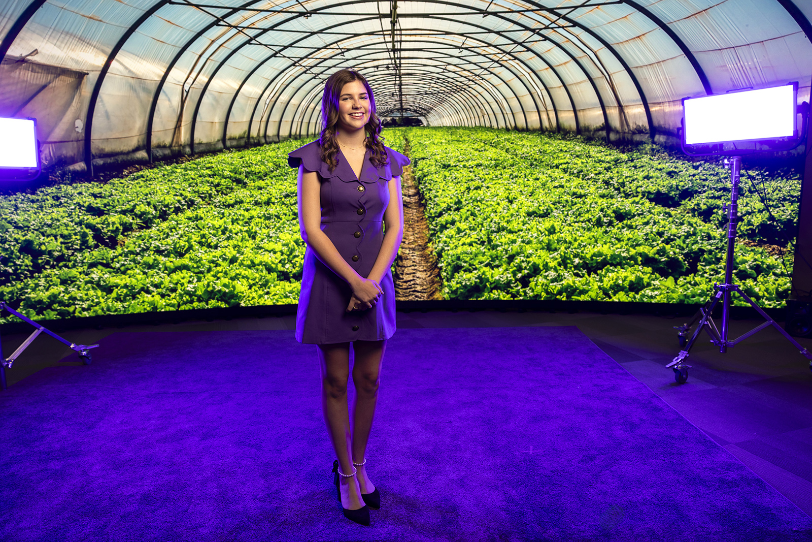 Emilee Bullock portrait with greenhouse backdrop