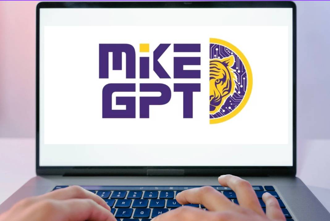 Computer with an image of the MikeGPT logo