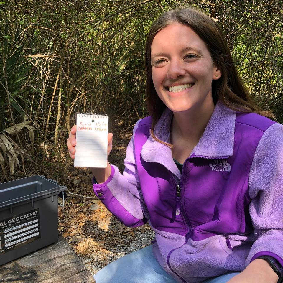 woman with note pad for geocaching