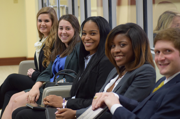 Students in business attire waiting for interviews