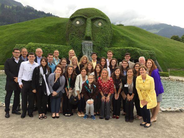 Group of students in front of green mountil in Austria