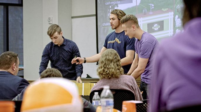 student presents idea at startup weekend