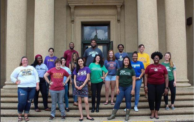 image of LSU's Higher Education Student Cohort posing in front of Memorial Tower