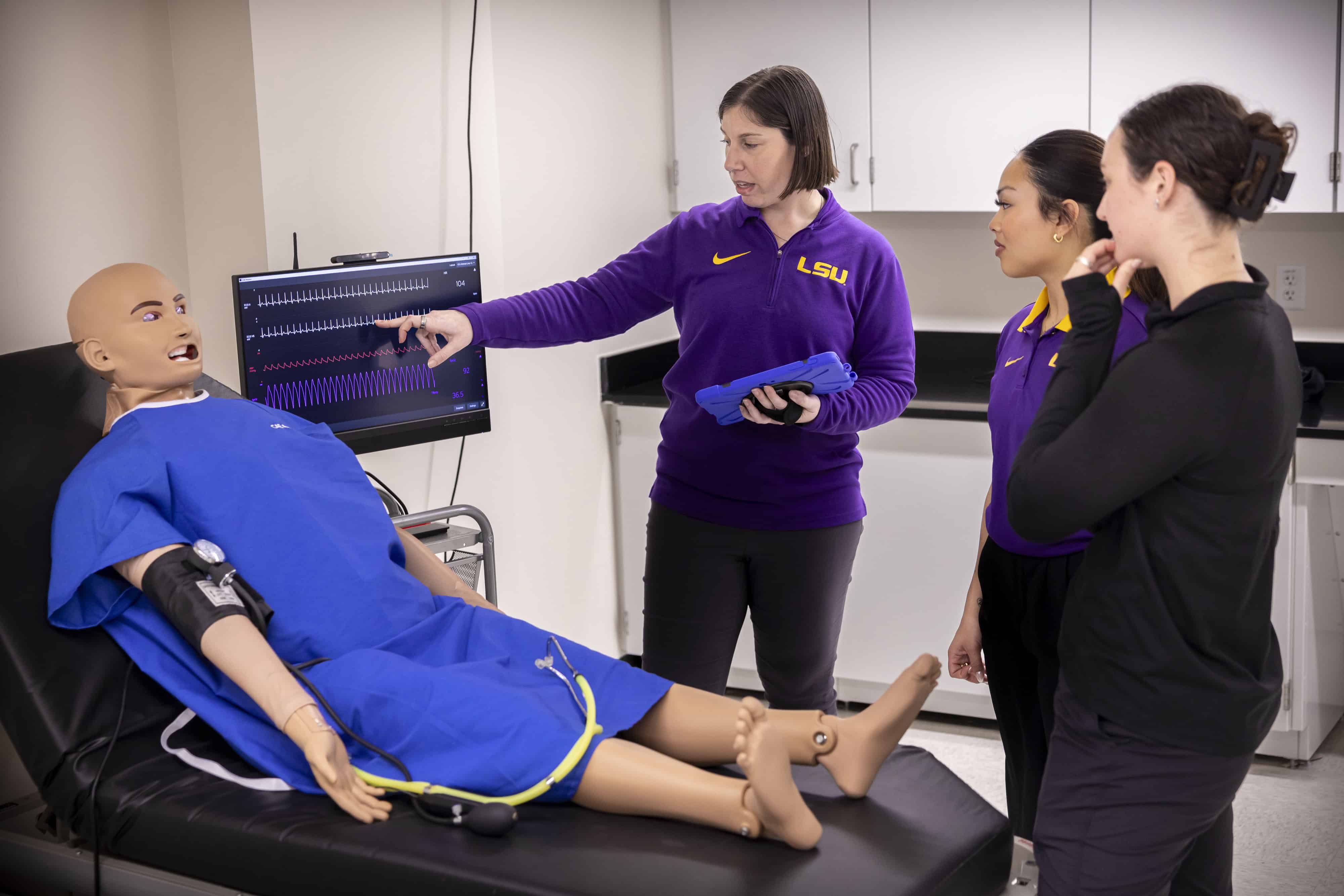 Rebecca Hirschhorn demonstrating on a patient simulator to athletic training students