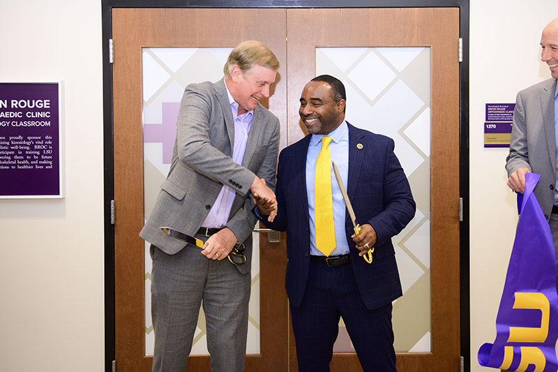 Trey Willliamson and Roland Mitchell cutting the ribbon on the BROC Classroom.