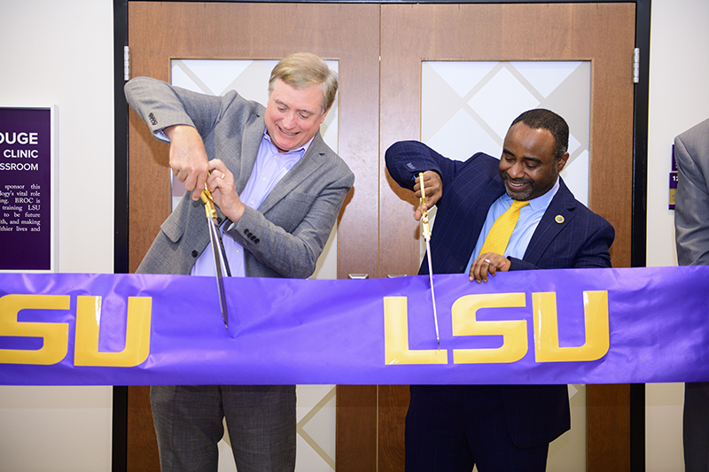 Trey Willliamson and Roland Mitchell cutting the ribbon on the BROC Classroom.