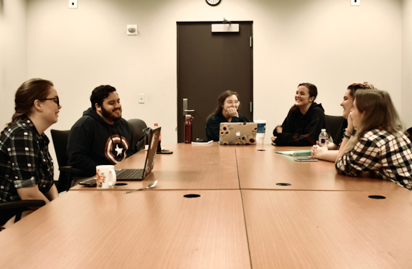 Image of students working in an office