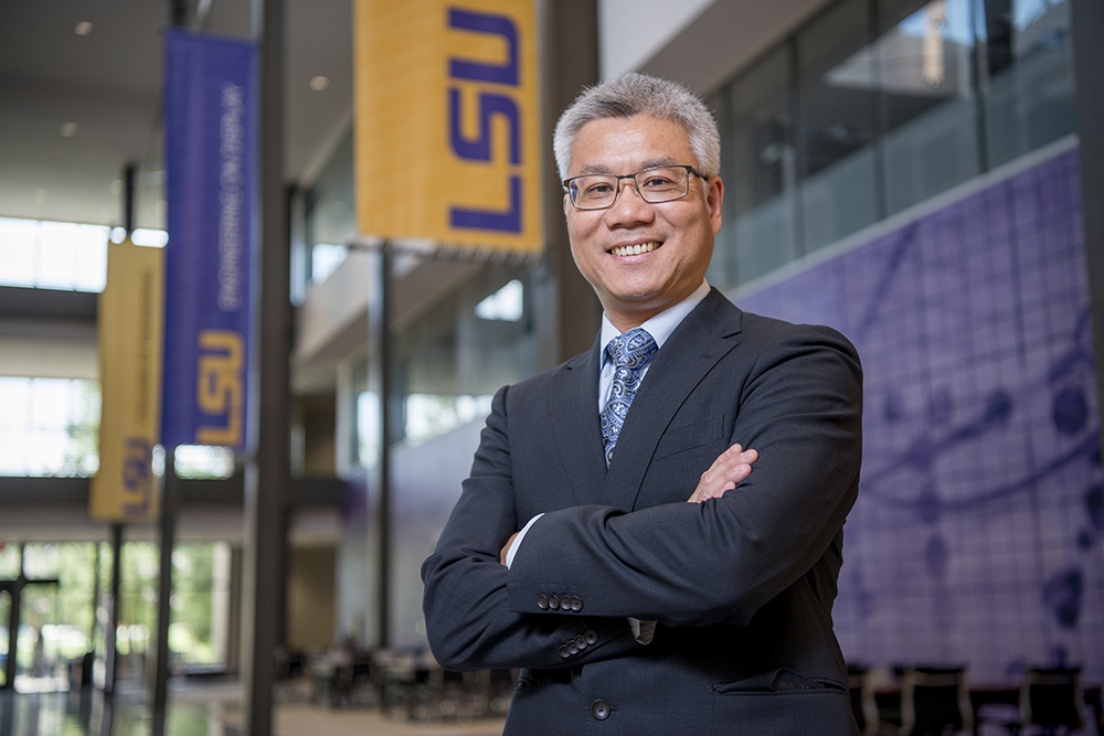 Frank Tsai stands in the Cambre Atrium