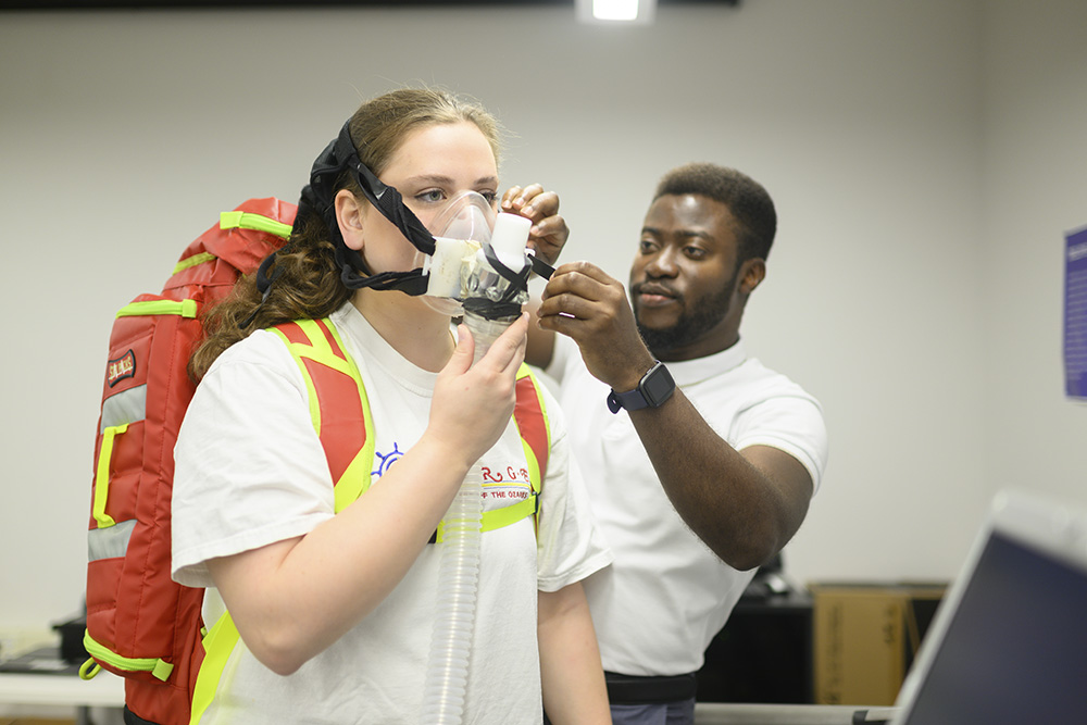 Students testing protective apparatus