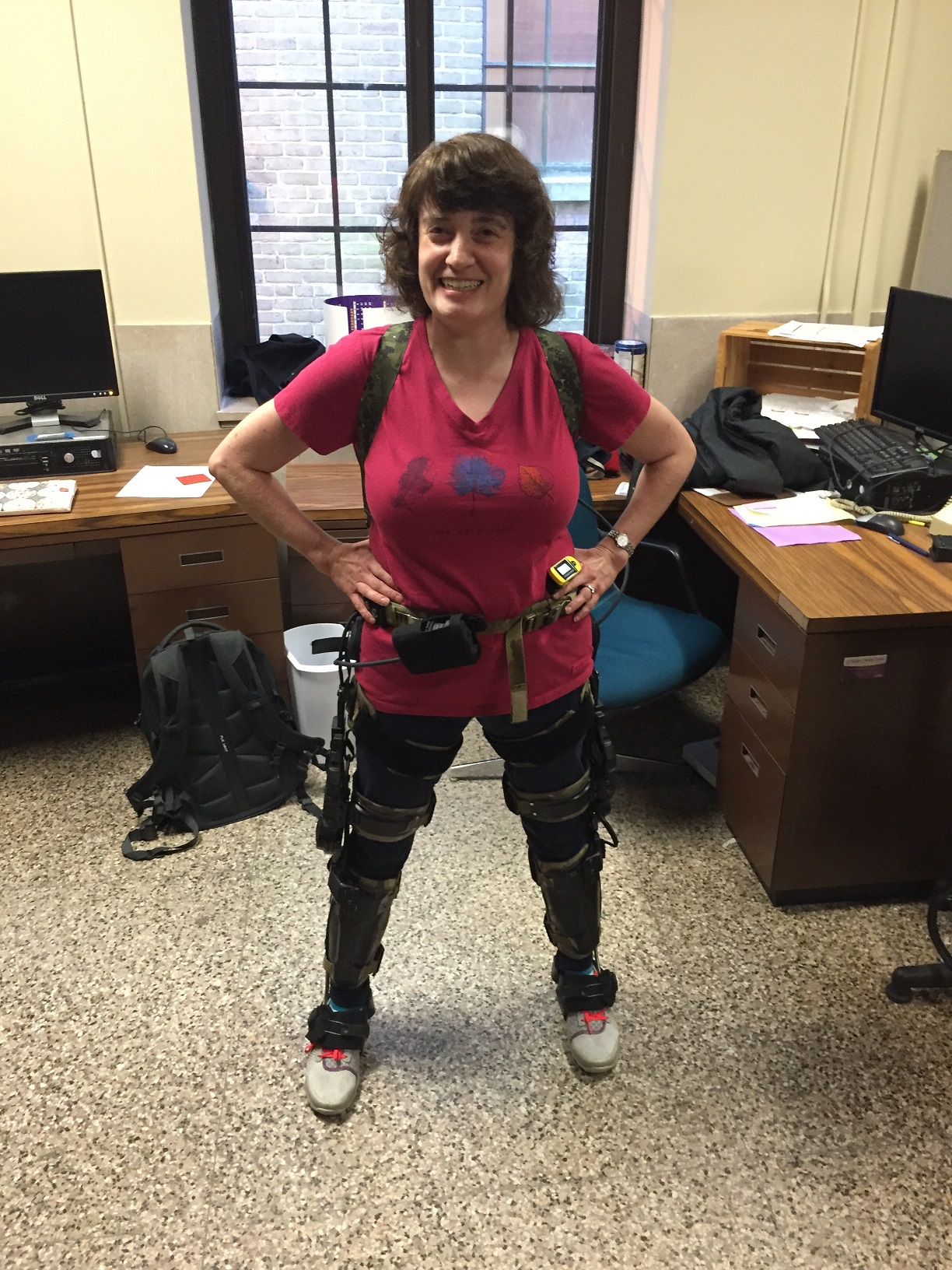 Laura Ikuma wearing an exoskeleton machine.
