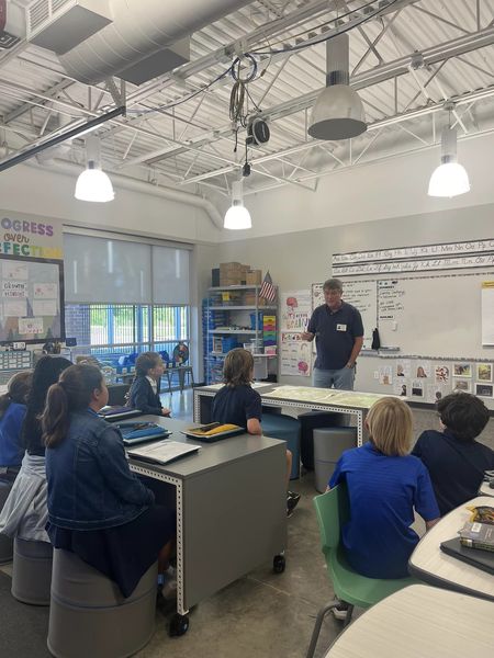 Dr. Leitner discusses maps with the students