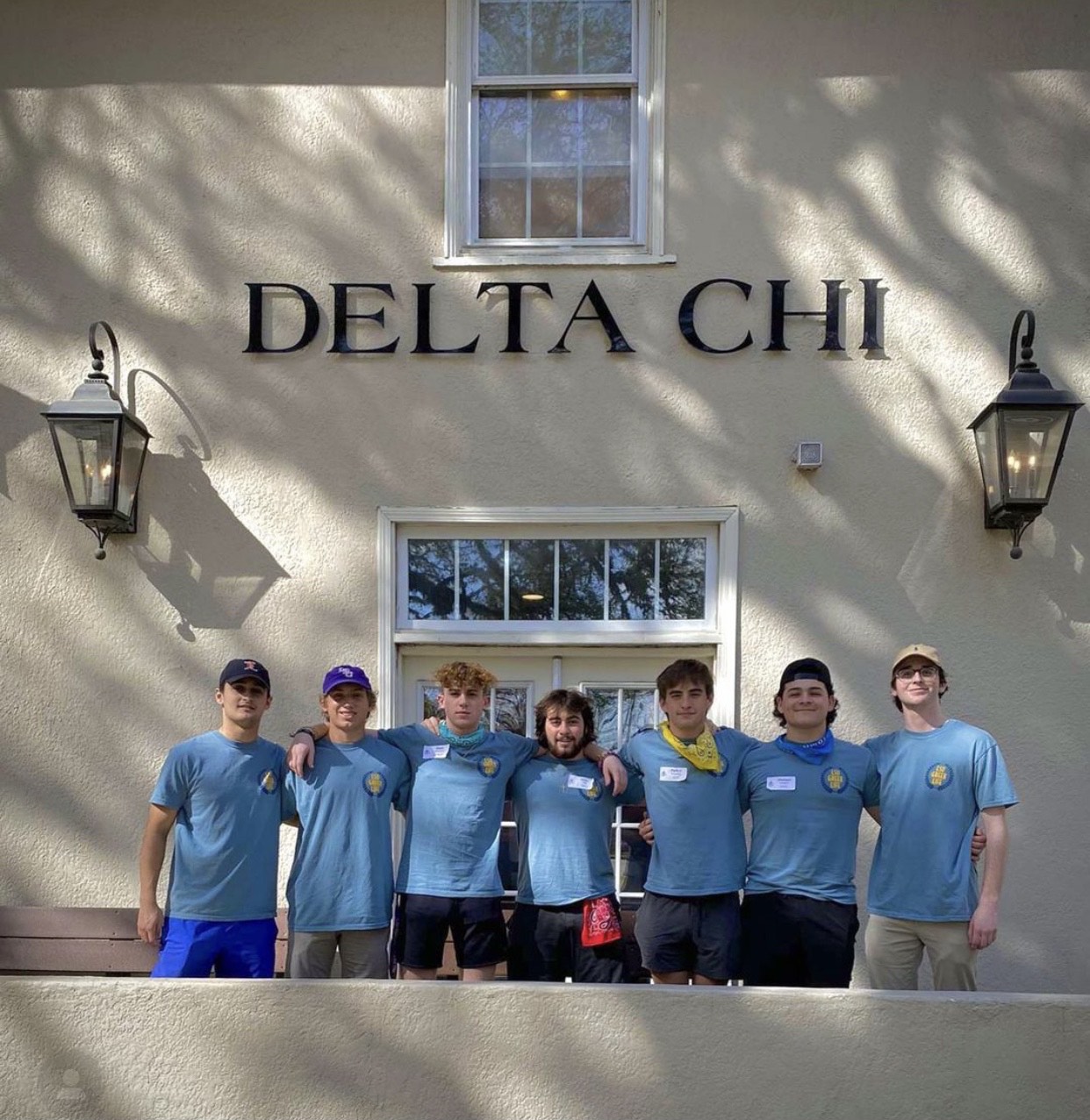 delta chi members in front of house