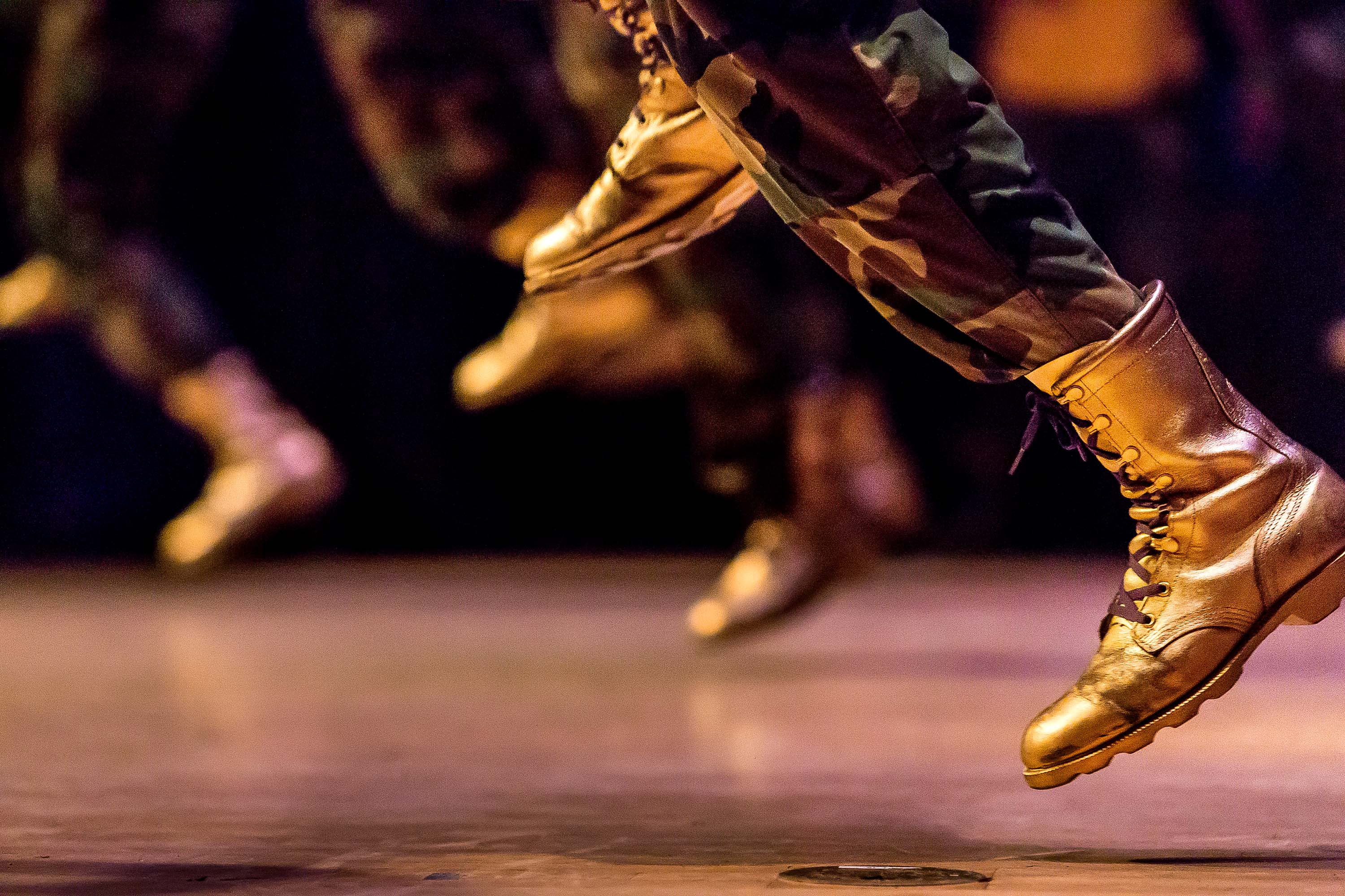 gold boots at step show