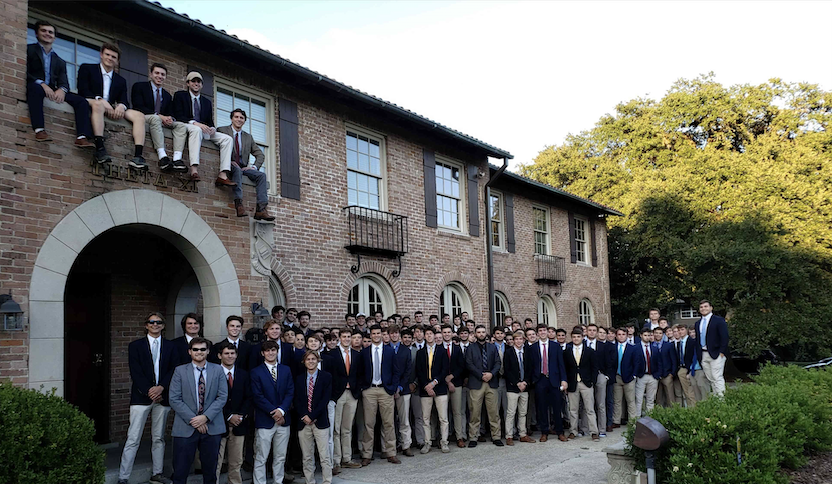 theta xi members in front of fraternity house