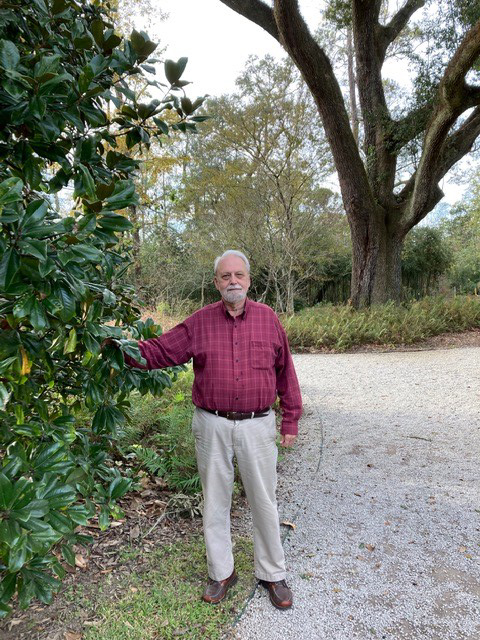 Bob Dillemuth by southern magnolia at Hilltop