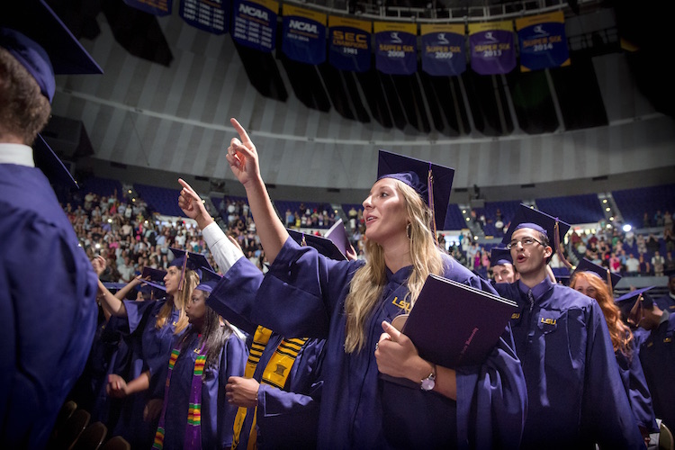photo: students reciting alma mater at commencement