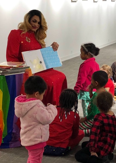 Lady Danisha Andrews reads to a group of children