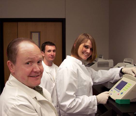 Mark Batzer in lab with students Charles Sasser and Jessica Zack 