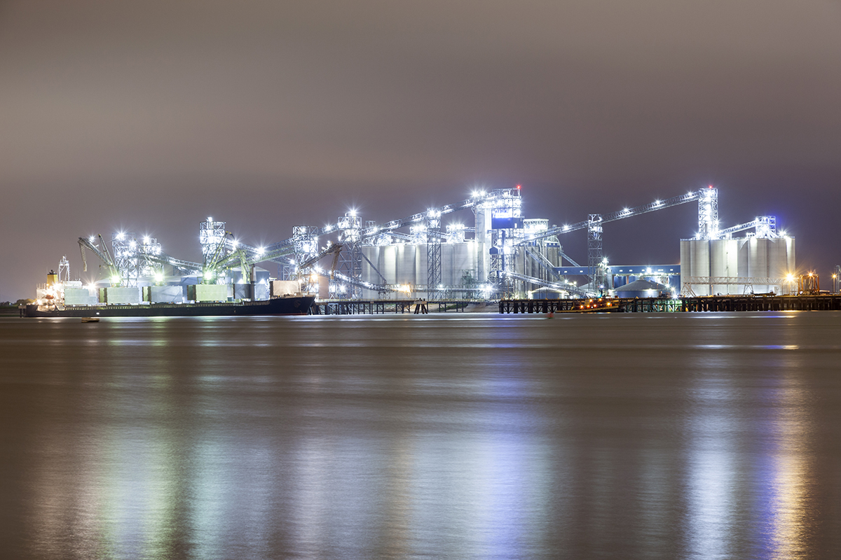 nighttime view of refineries from river 