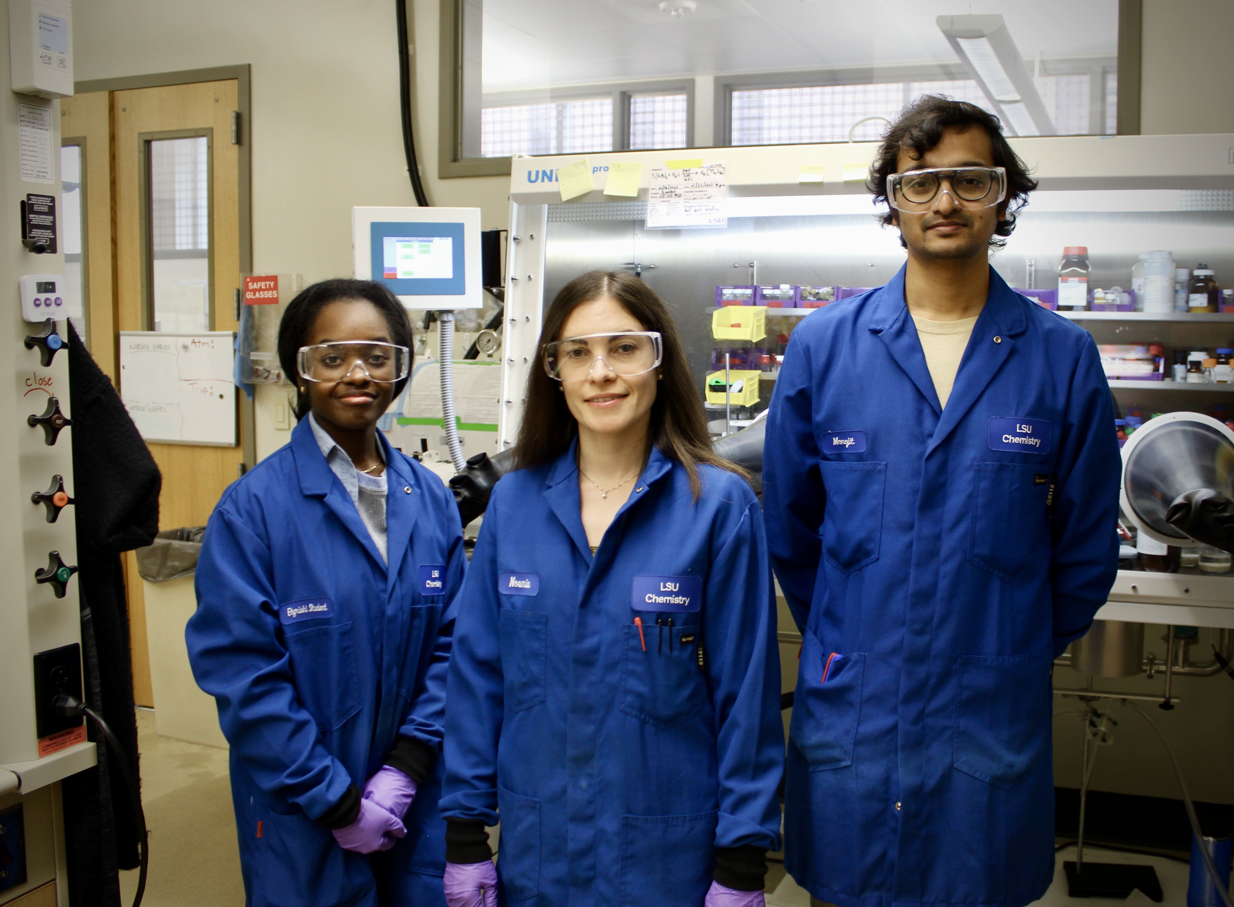 Dr. Elgrishi with two students in the lab