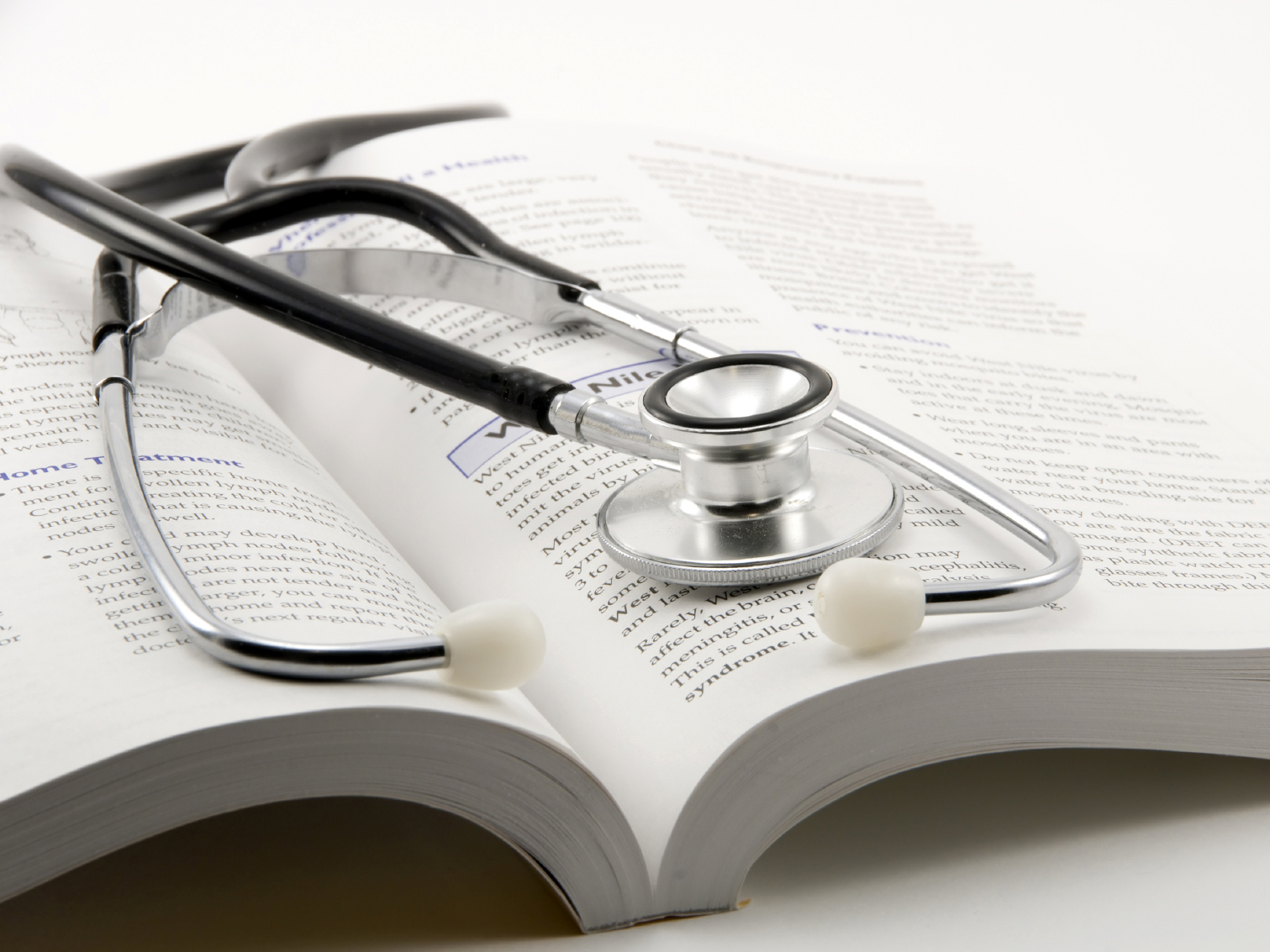 medical textbook and stethoscope