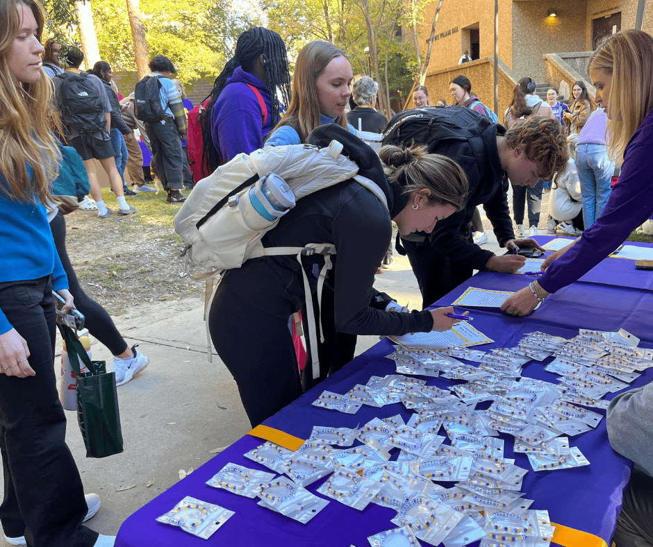 Students checking in at the event and picking up swag.