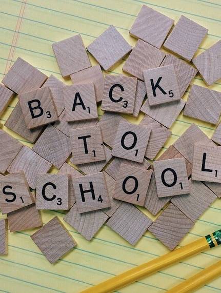 back to school displayed with scrabble tiles