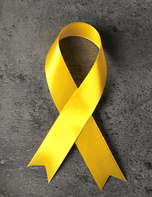 Photo of a yellow ribbon on a grey background