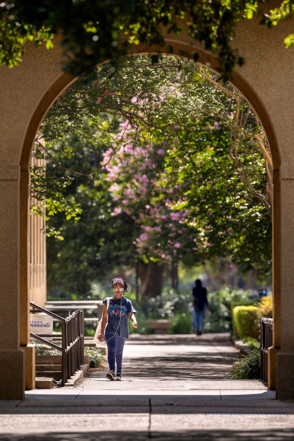 a student walking in the quad