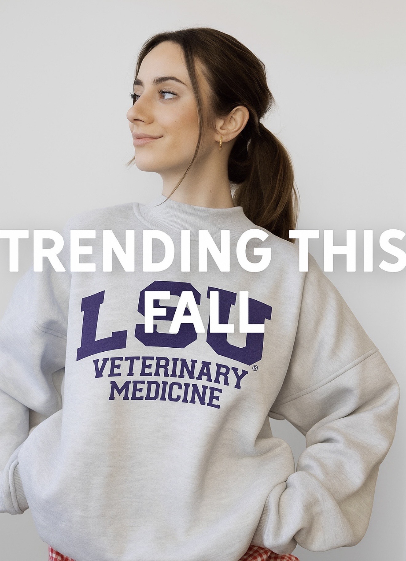 Female model wearing gray sweatshirt with purple LSU Veterinary Medicine