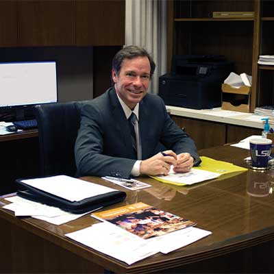 Dr. Baines at his desk